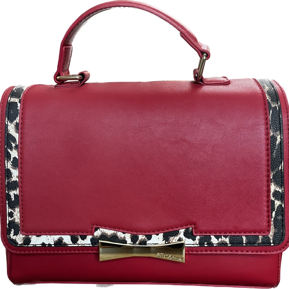 Betsy Johnson red purse with leopard print trim.